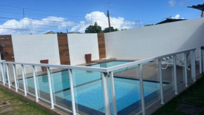 Casa com piscina próximo a praia